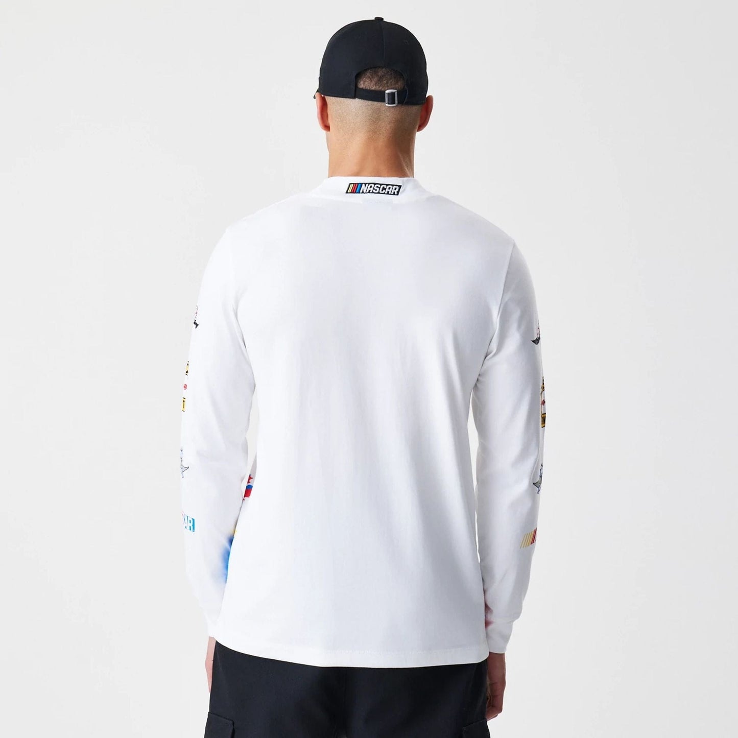 The Male model is wearing Nascar Generic Logo Modern Driver White Long Sleeve T-Shirt 2
