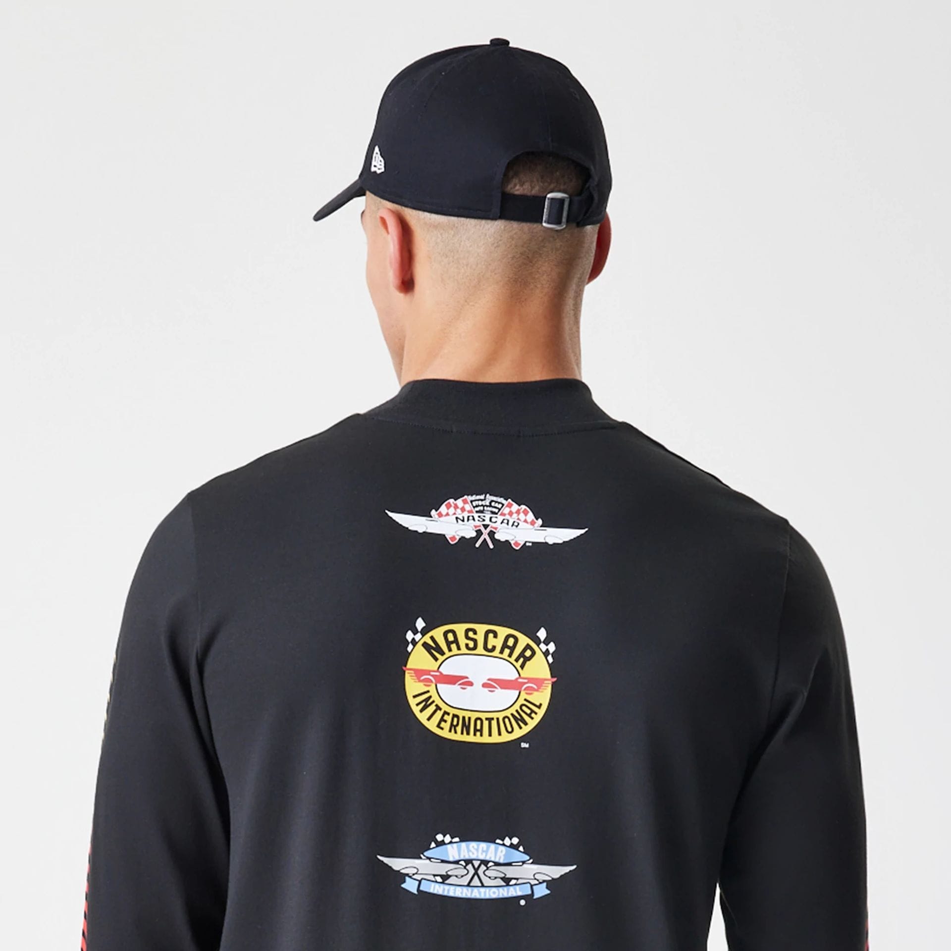 The Male model is wearing Nascar Generic Logo Modern Driver Black Long Sleeve T-Shirt 5