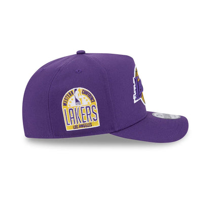 LA Lakers NBA Evergreen Purple New Era 9FIFTY A-Frame Snapback Adjustable Cap, side view showing the Western Conference Champions patch on the left side and the team logo on the front panel with a curved visor and 9FIFTY size sticker.