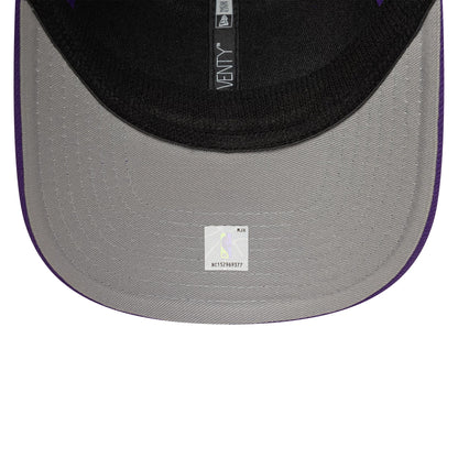 LA Lakers NBA Evergreen Purple New Era 9SEVENTY Stretch Snap Adjustable Cap, inside view showing black fabric taping with 9SEVENTY branding, a black sweatband, and a small white sticker on the grey undervisor.
