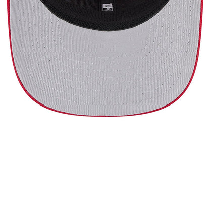 Cincinnati Reds MLB Evergreen Red New Era 9SEVENTY Stretch Snap Adjustable Cap, inside view showing a grey undervisor with red stitching, a black sweatband, and the New Era logo on the taping.