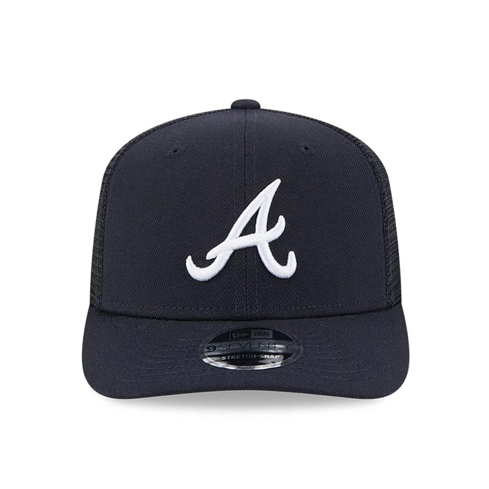 Atlanta Braves MLB Evergreen Navy New Era 9SEVENTY Stretch Snap Adjustable Cap, front view with a raised white A logo on the front panel, featuring a curved visor and a 9SEVENTY size sticker on top of the visor.