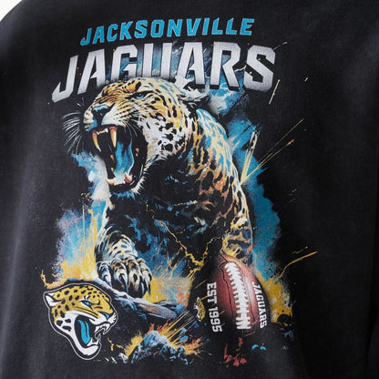 The Male model is wearing Jacksonville Jaguars NFL Games Premium Apparel Black Oversized Pullover Hoodie 5