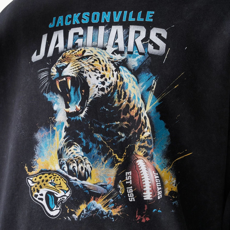 The Male model is wearing Jacksonville Jaguars NFL Games Premium Apparel Black Oversized Pullover Hoodie 5