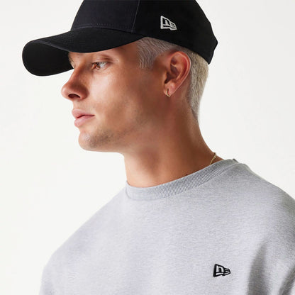 The Male model is wearing New Era Essential Brushed Fleece Grey Crewneck Sweater 4