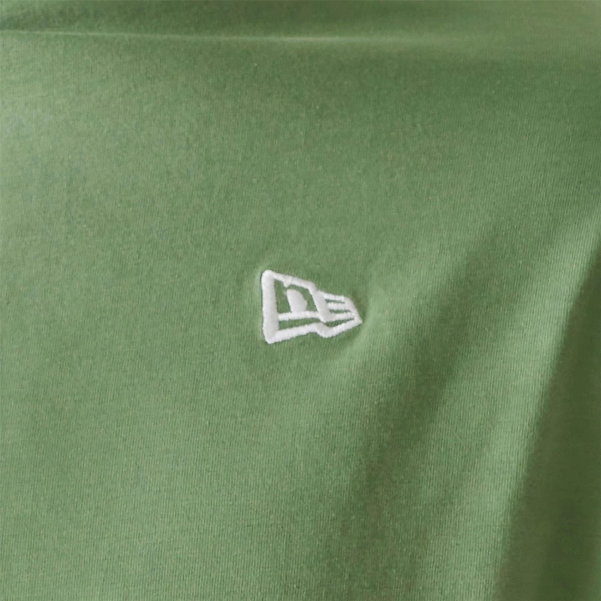 The Male model is wearing New Era Essential Green Oversized T-Shirt 4