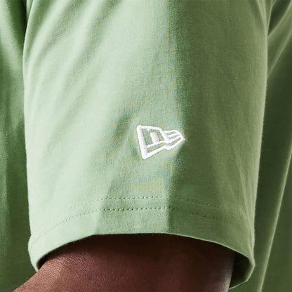 The Male model is wearing New Era Essential Green Oversized T-Shirt 5