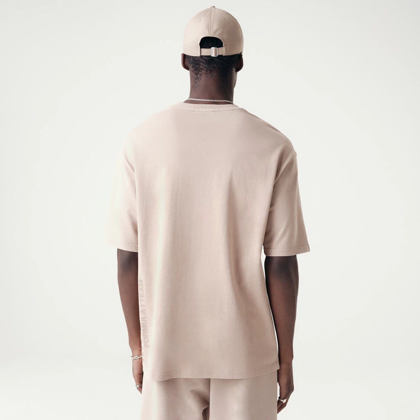 The Male model is wearing McLaren Racing Washed Pack Beige Oversized T-Shirt 2