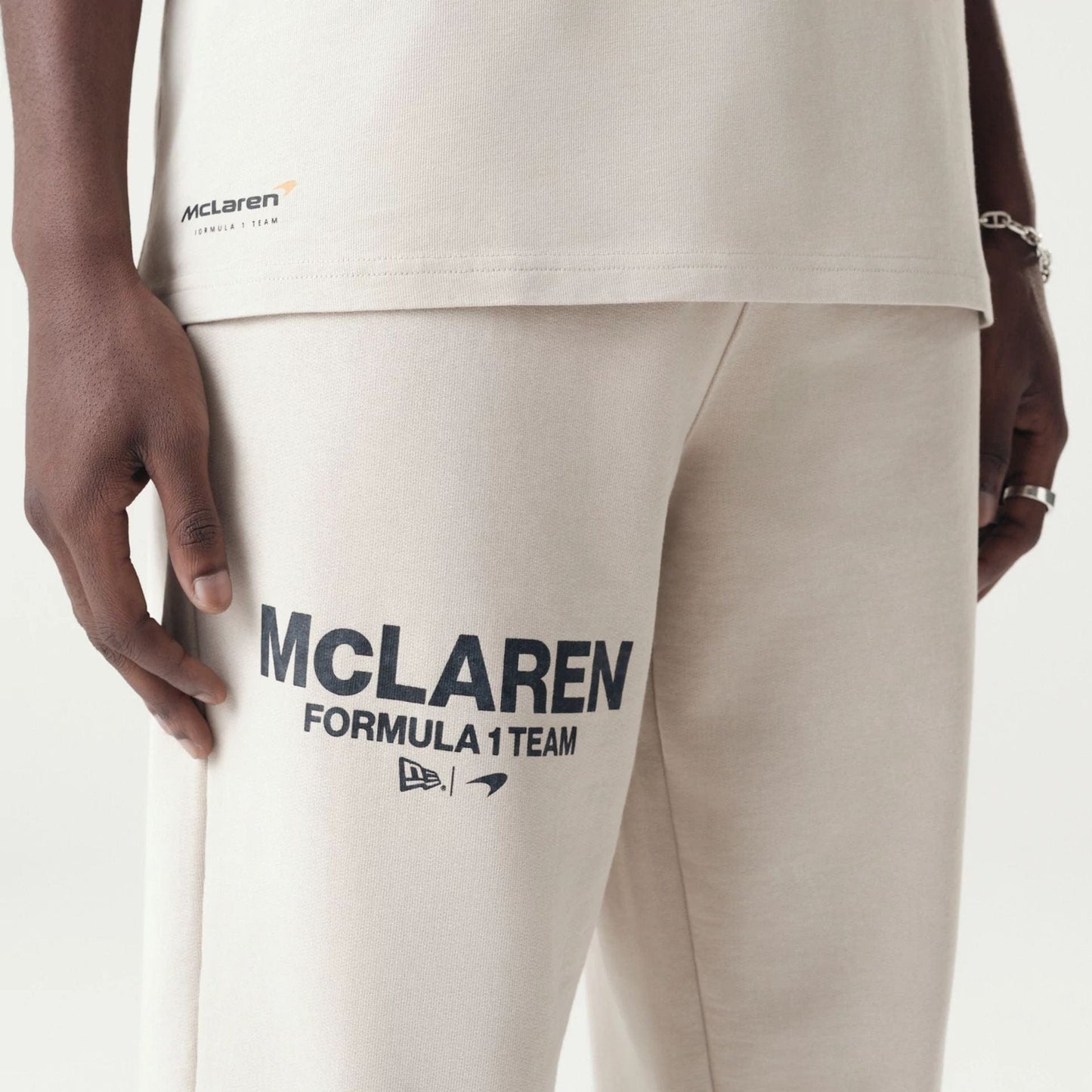 The Male model is wearing McLaren Racing Washed Pack Cream Straight Leg Joggers 5