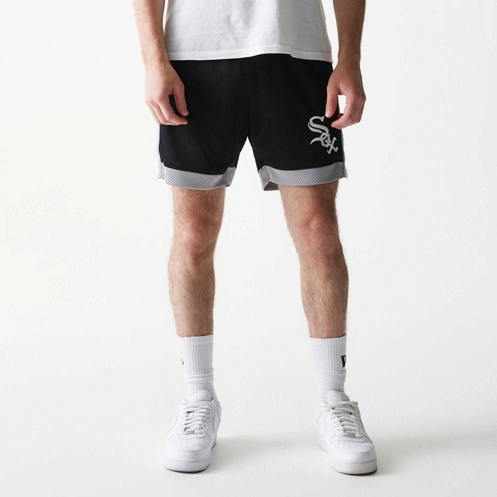 The Male model is wearing Chicago White Sox Sport Classic Black Shorts 7