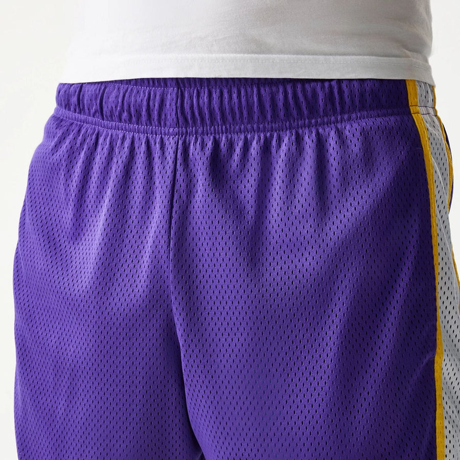 The Male model is wearing LA Lakers Sport Classic Purple Shorts 5