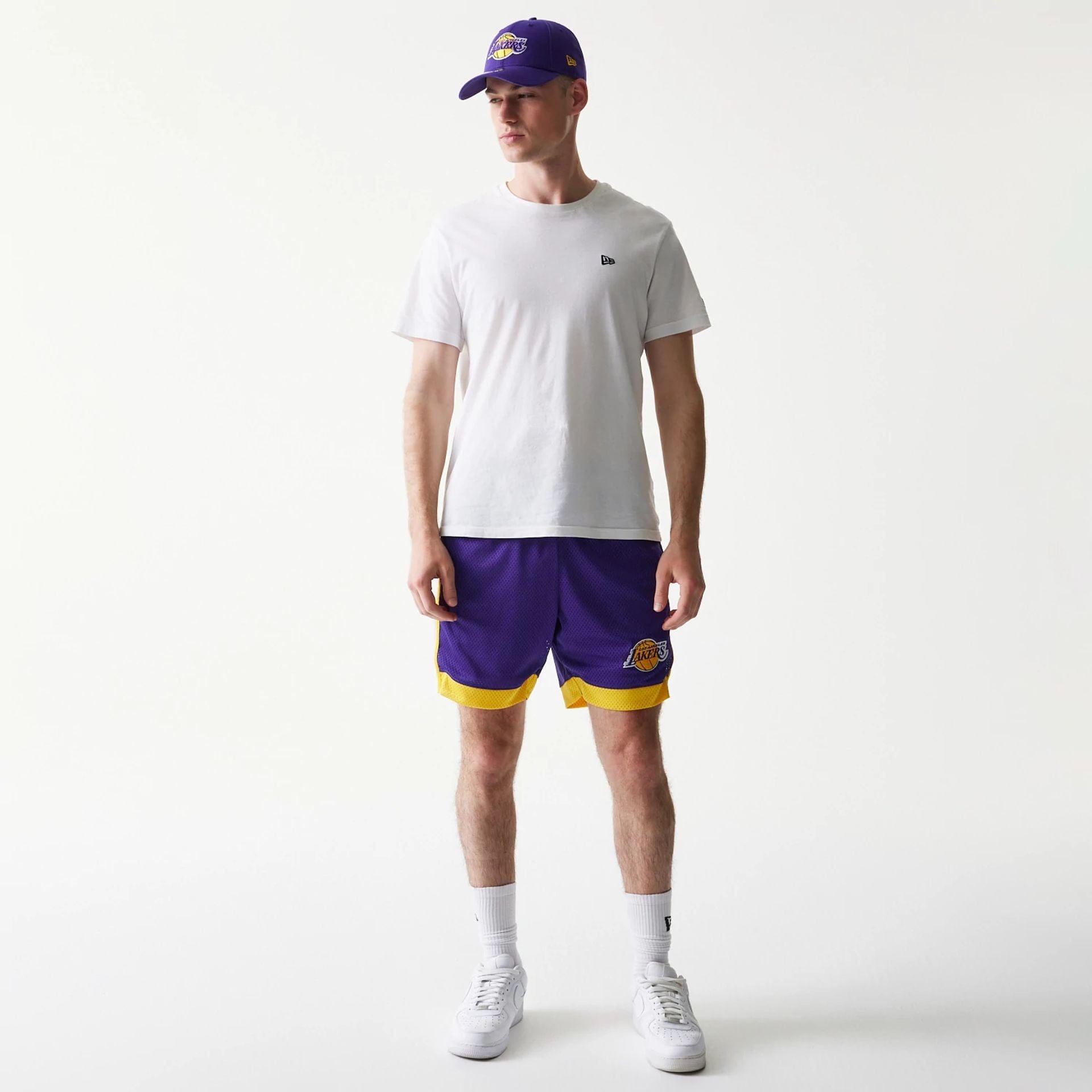 The Male model is wearing LA Lakers Sport Classic Purple Shorts 8