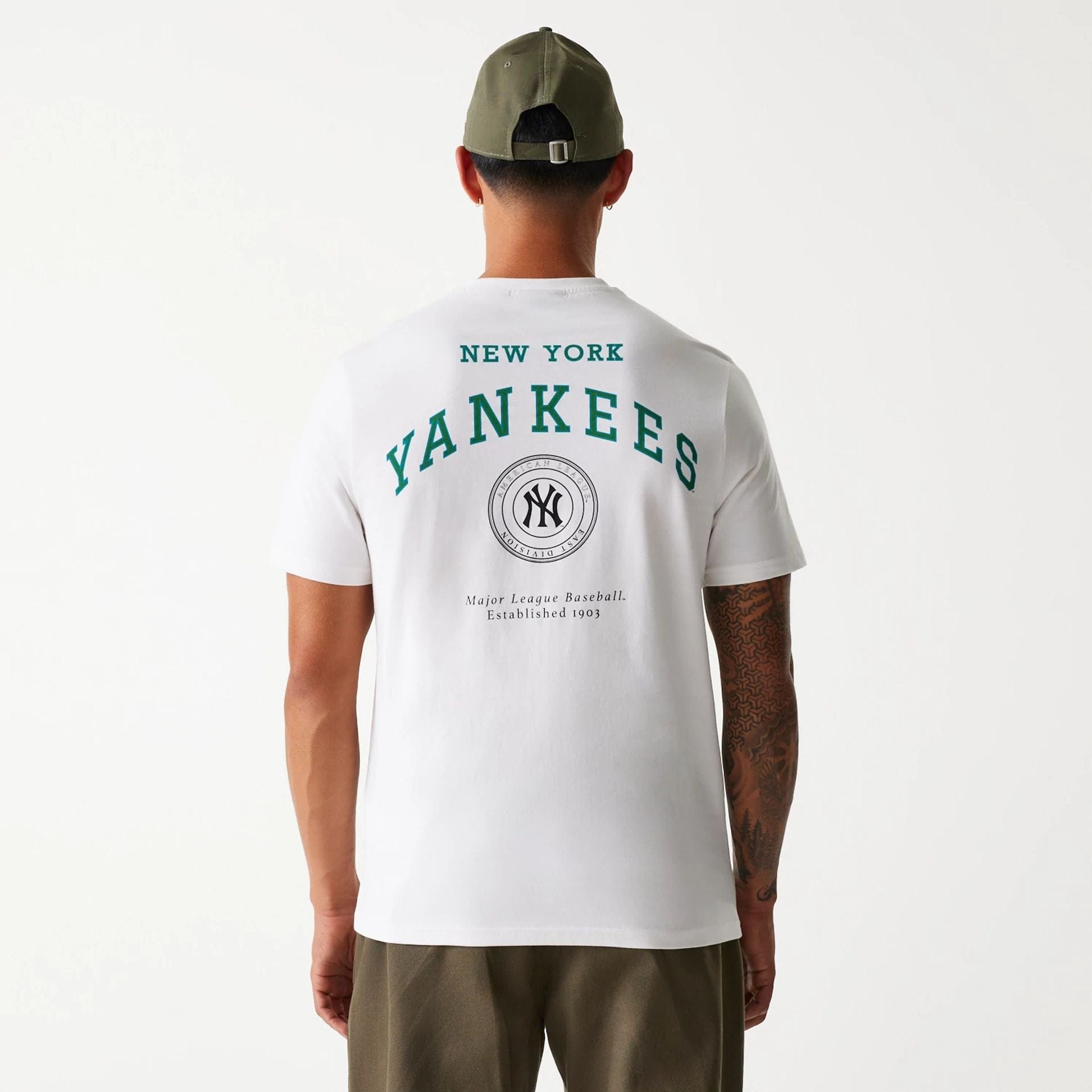 The Male model is wearing New York Yankees MLB Arch Graphic Open White T-Shirt 2
