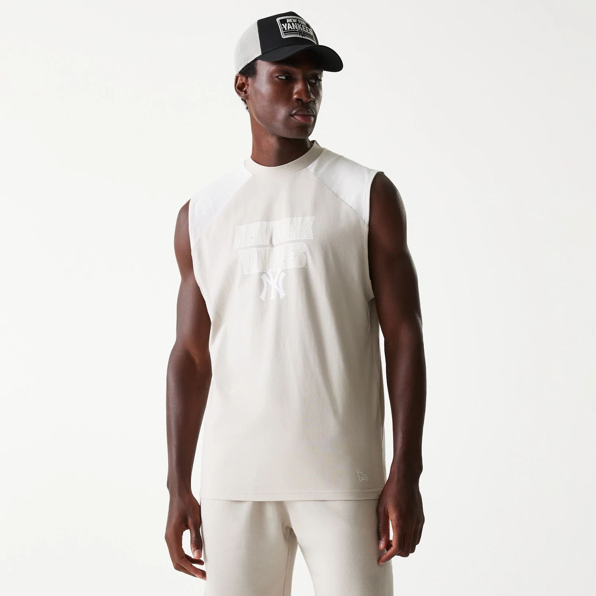 The Male model is wearing New York Yankees MLB Cream Sleeveless T-Shirt 1