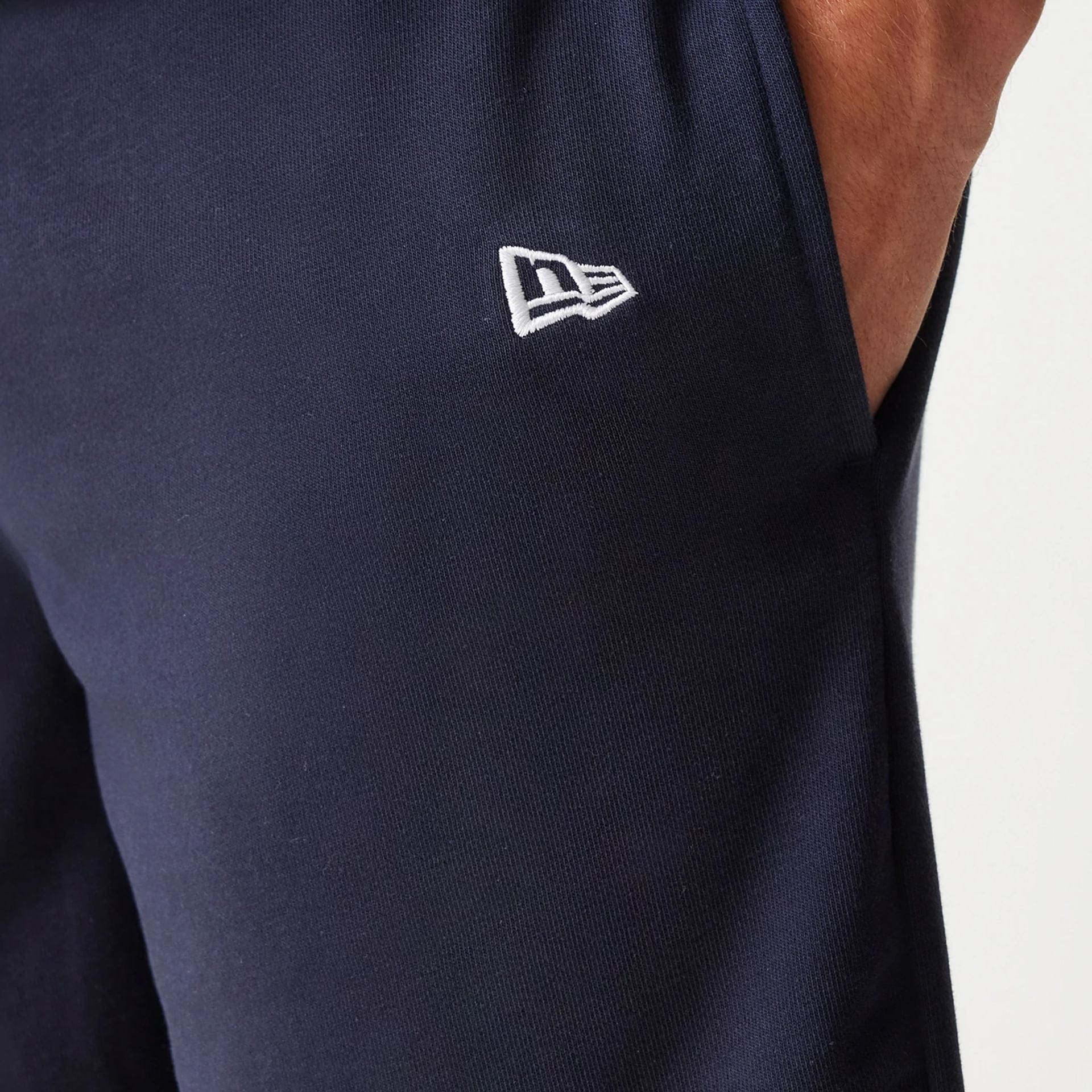 The Male model is wearing New York Yankees MLB League Essential Navy Shorts 5