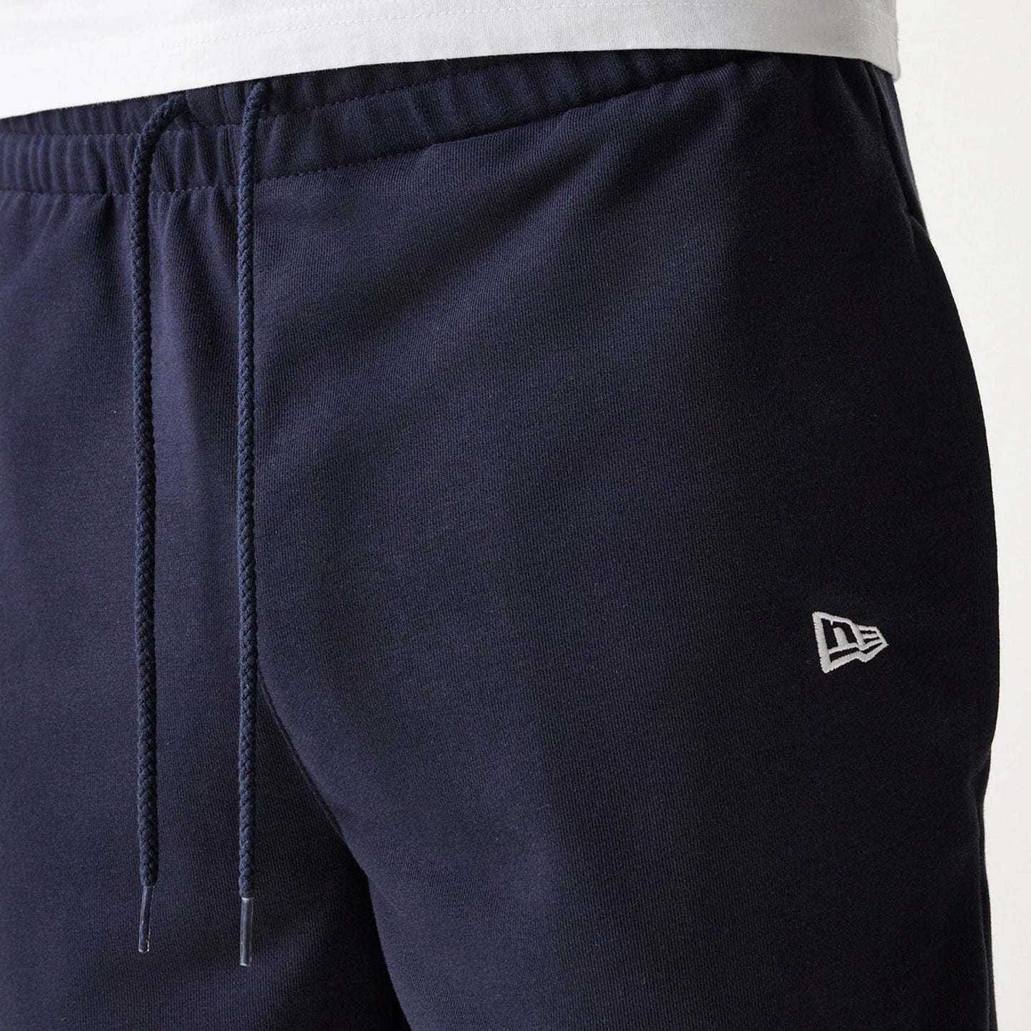 The Male model is wearing New York Yankees MLB League Essential Navy Shorts 6