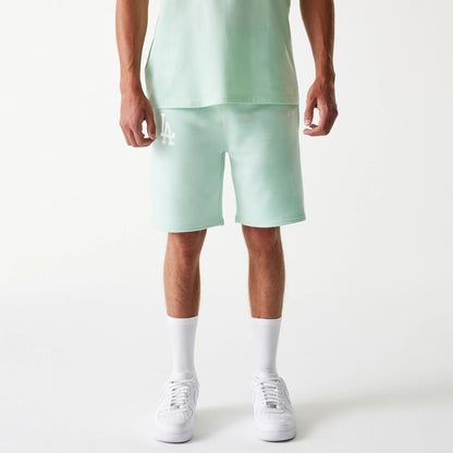 The Male model is wearing LA Dodgers MLB League Essential Pastel Green Shorts 1
