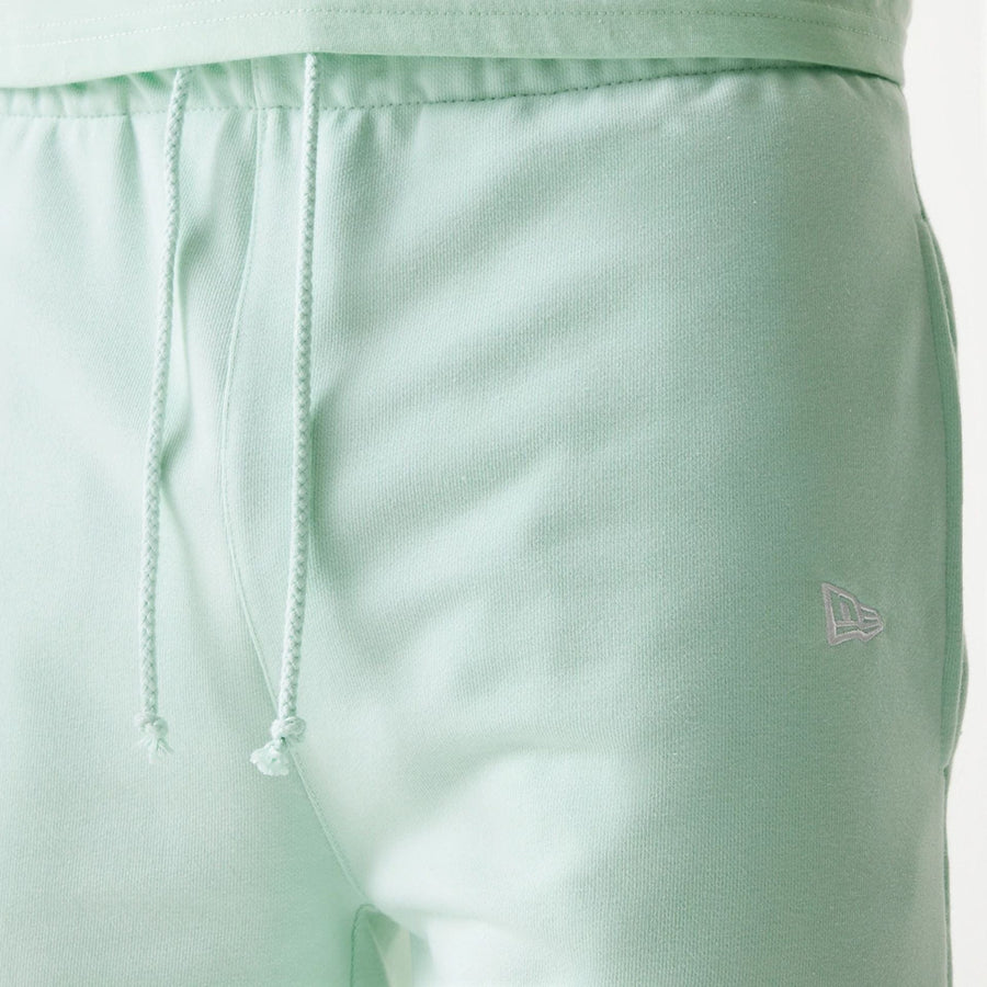 The Male model is wearing LA Dodgers MLB League Essential Pastel Green Shorts 6