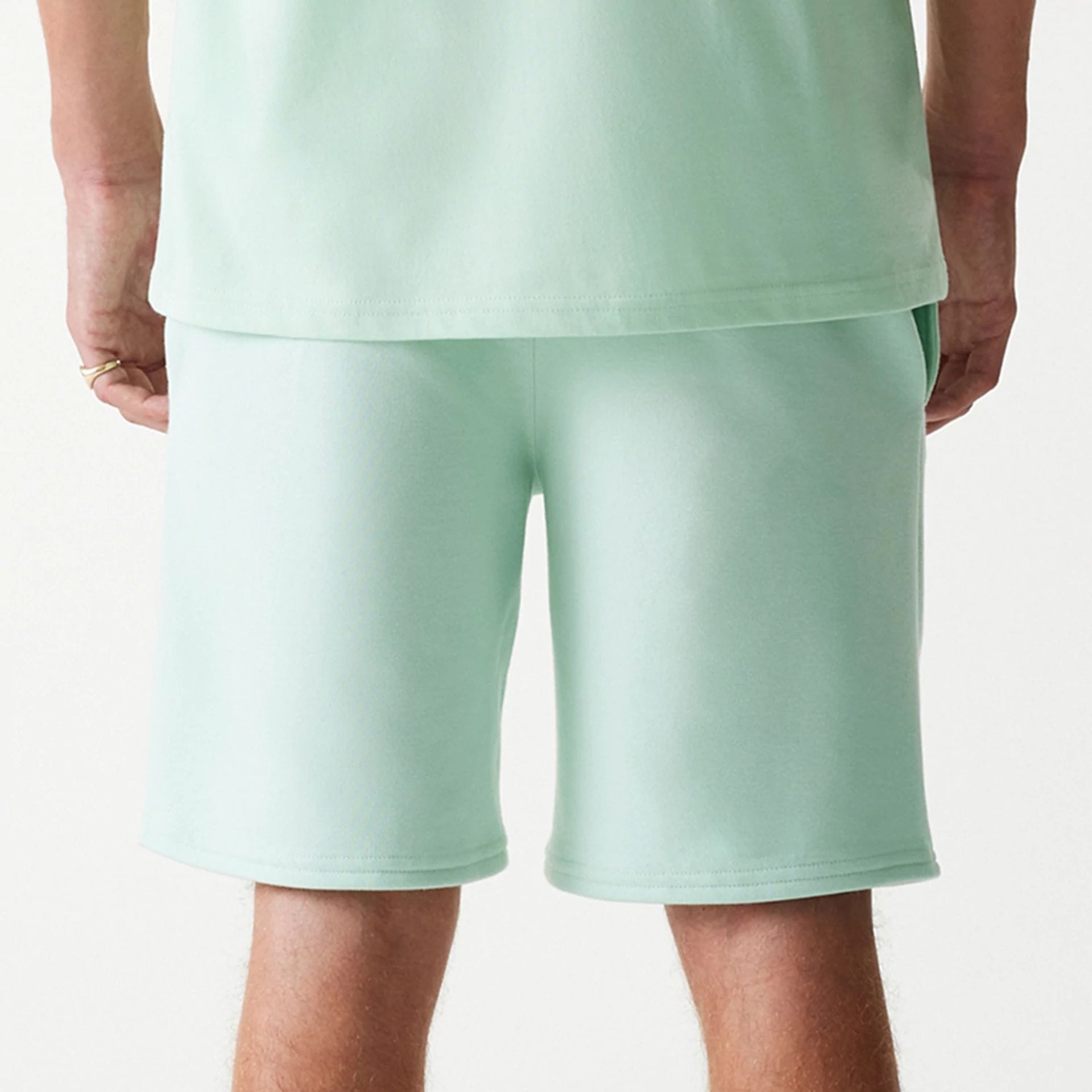 The Male model is wearing LA Dodgers MLB League Essential Pastel Green Shorts 7