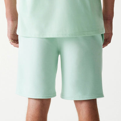 The Male model is wearing LA Dodgers MLB League Essential Pastel Green Shorts 7