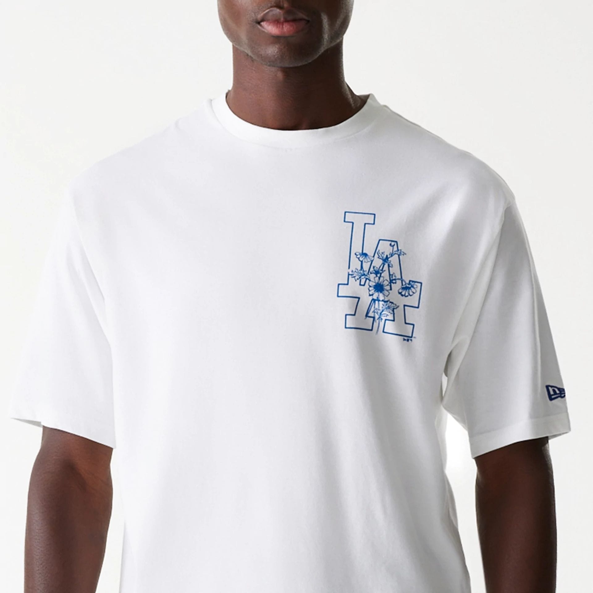 The Male model is wearing LA Dodgers MLB Floral Graphic White Oversized T-Shirt 3