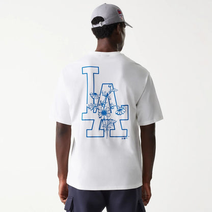 The Male model is wearing LA Dodgers MLB Floral Graphic White Oversized T-Shirt 2