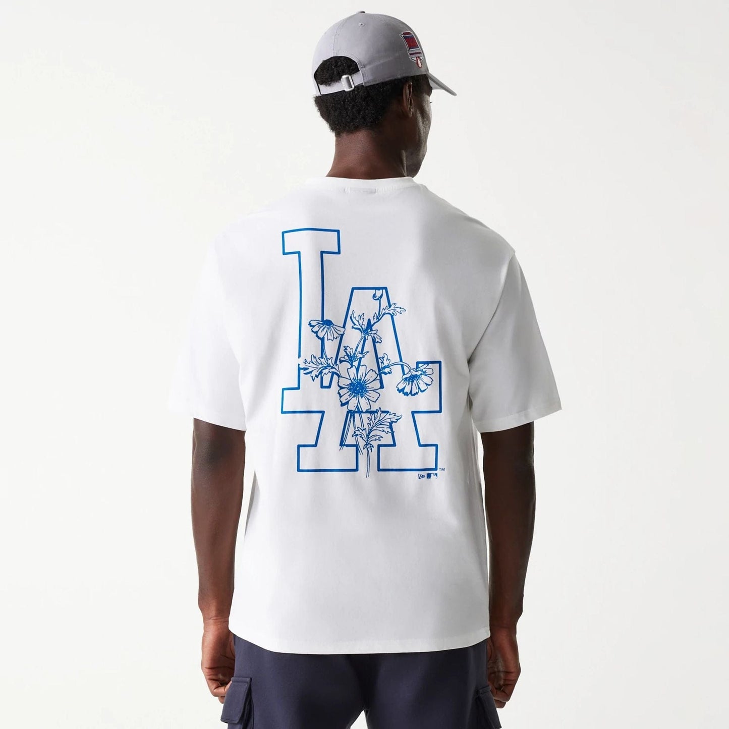 The Male model is wearing LA Dodgers MLB Floral Graphic White Oversized T-Shirt 2