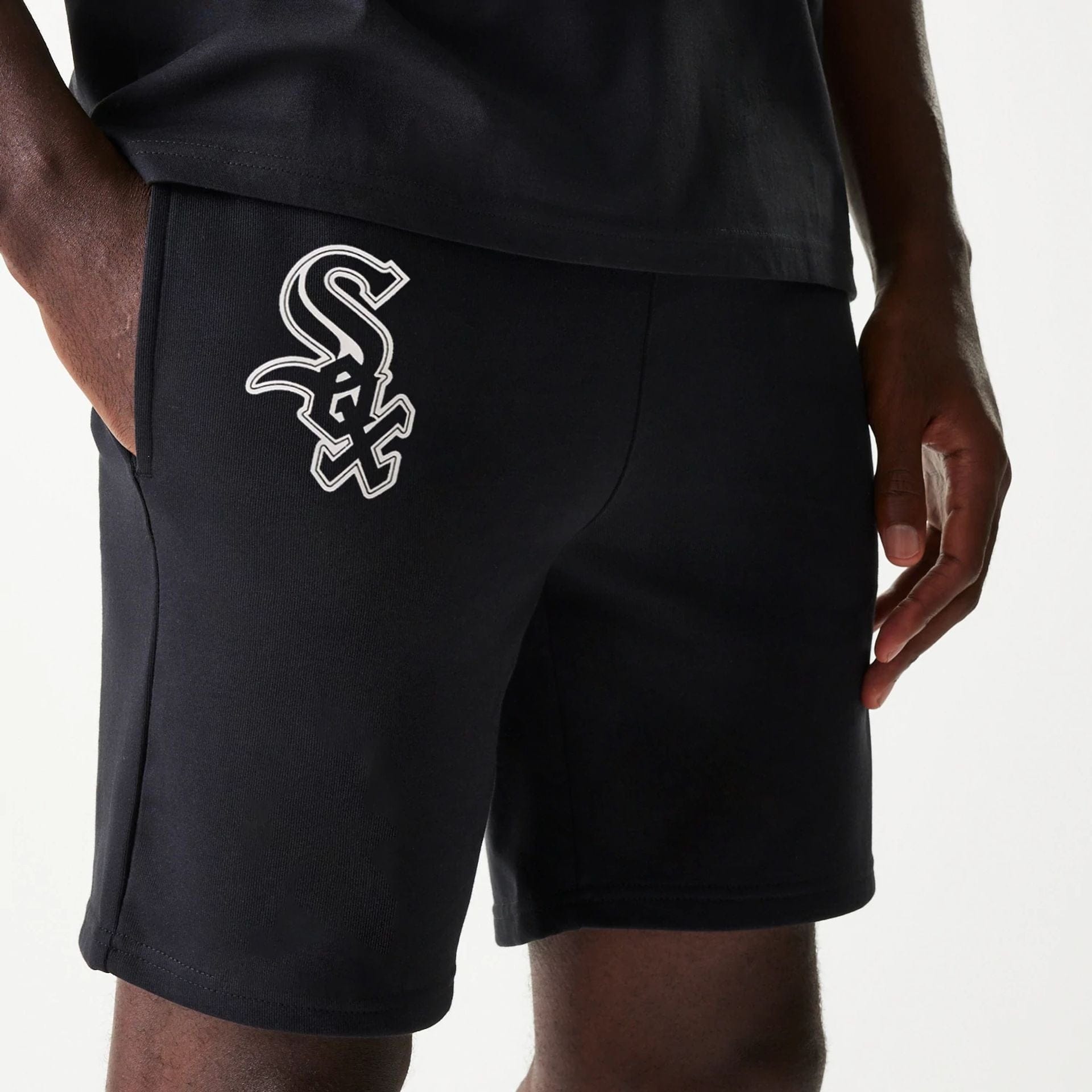 The Male model is wearing Chicago White Sox MLB League Essential Black Shorts 3