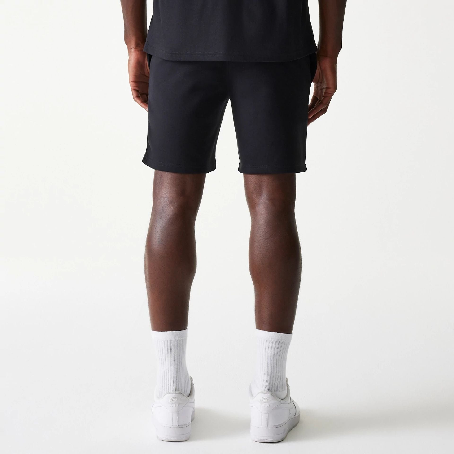 The Male model is wearing Chicago White Sox MLB League Essential Black Shorts 2