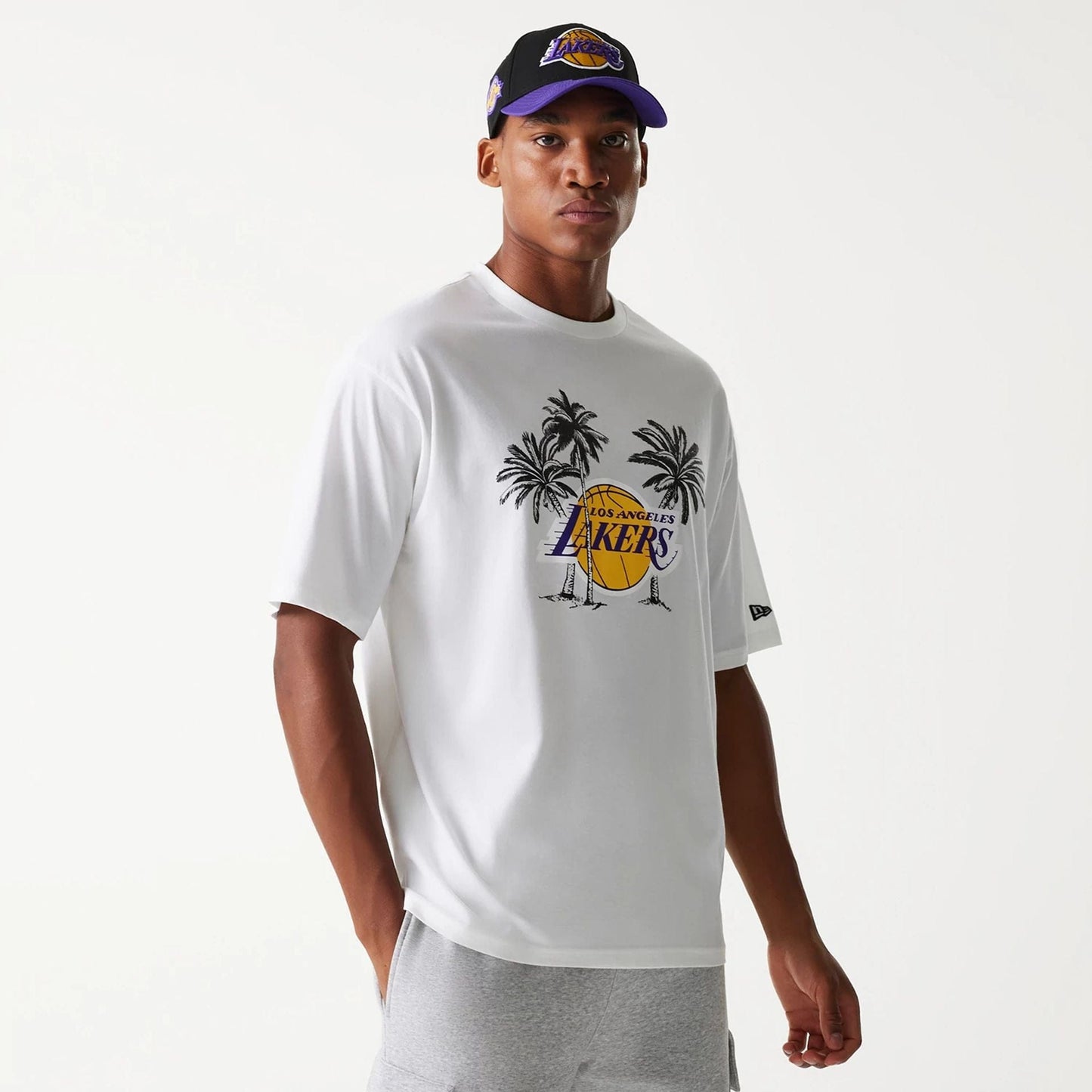 The Male model is wearing LA Lakers NBA Palm Tree White Oversized T-Shirt 1