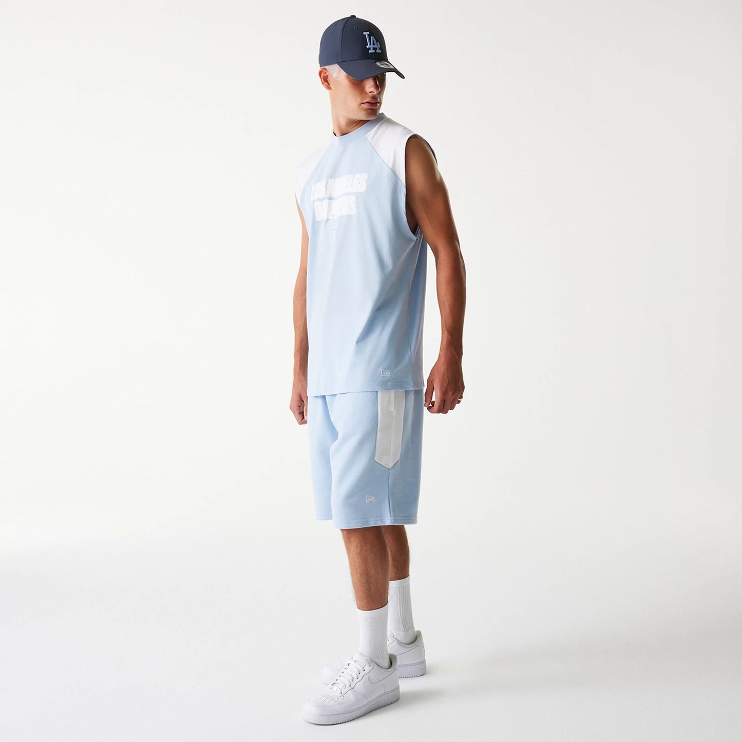 The Male model is wearing LA Dodgers MLB Raglan Pastel Blue Shorts 7