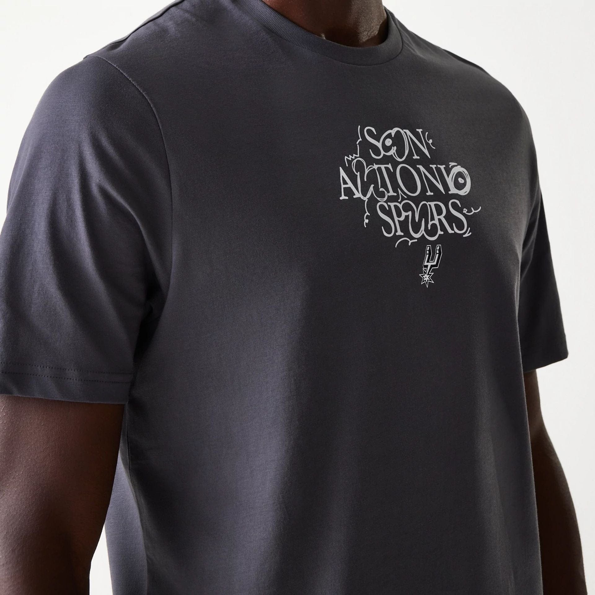 The Male model is wearing San Antonio Spurs NBA Court Graphic Dark Grey T-Shirt 6