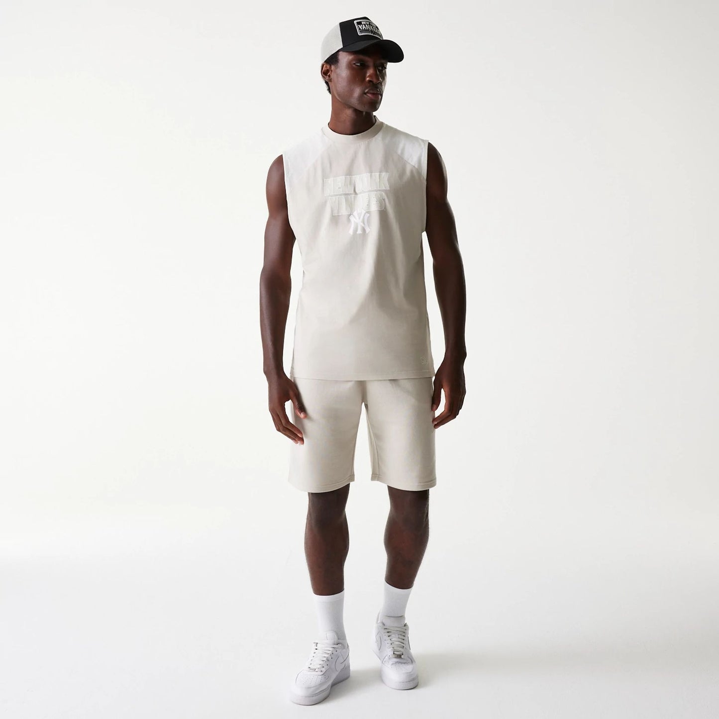 The Male model is wearing New York Yankees MLB Raglan Cream Shorts 8