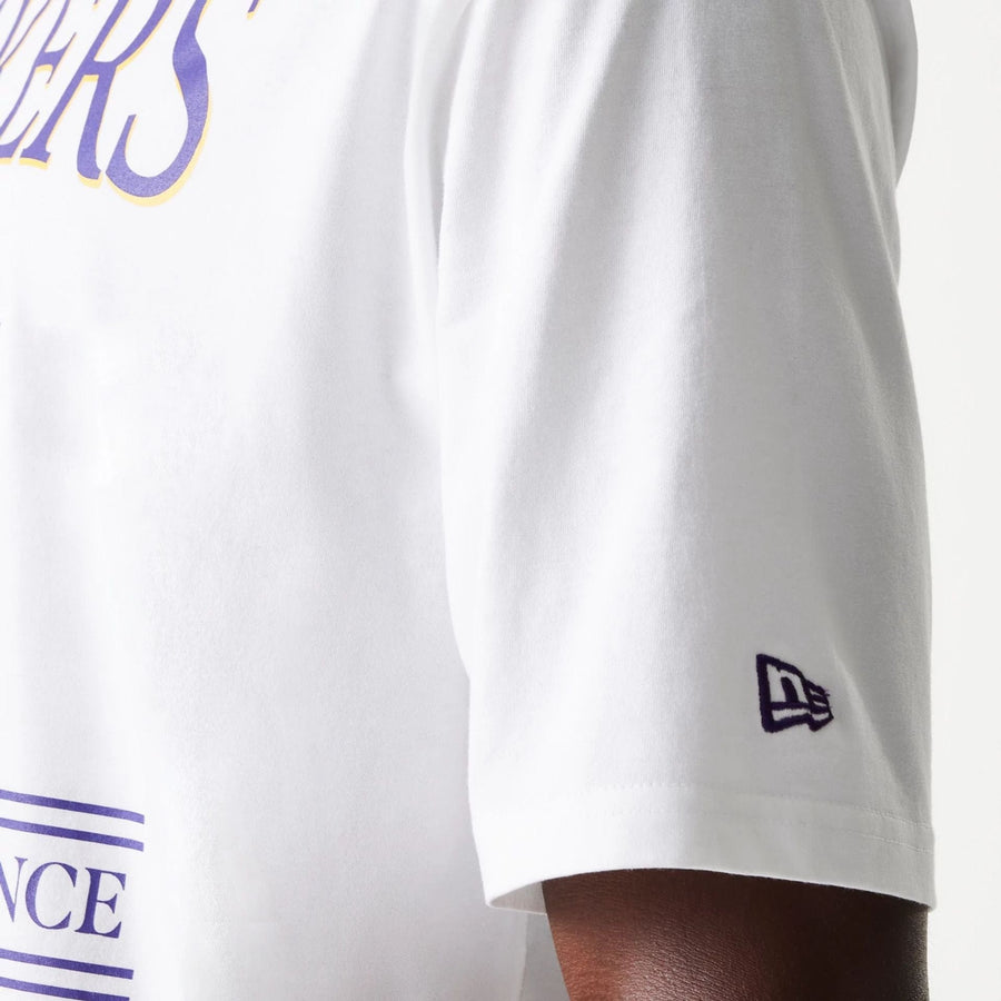 The Male model is wearing LA Lakers NBA Team Graphic White Oversized T-Shirt 6