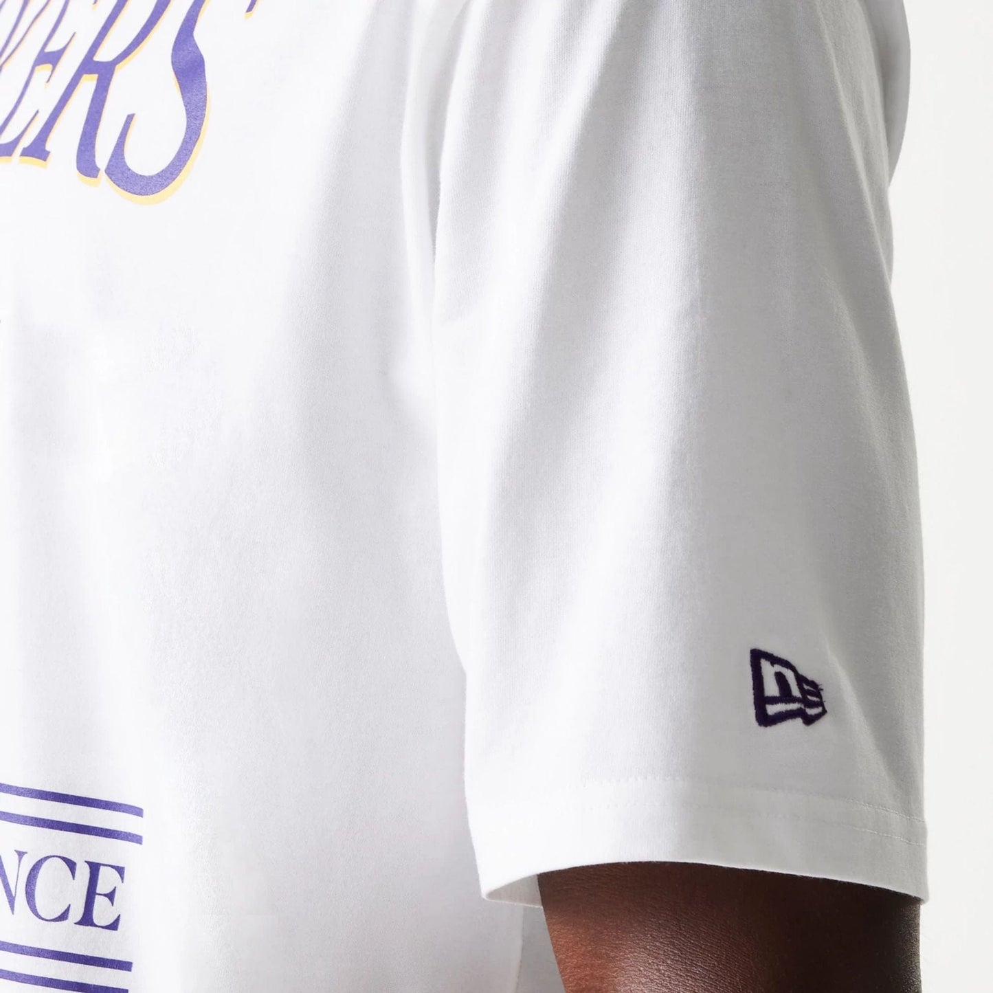 The Male model is wearing LA Lakers NBA Team Graphic White Oversized T-Shirt 6