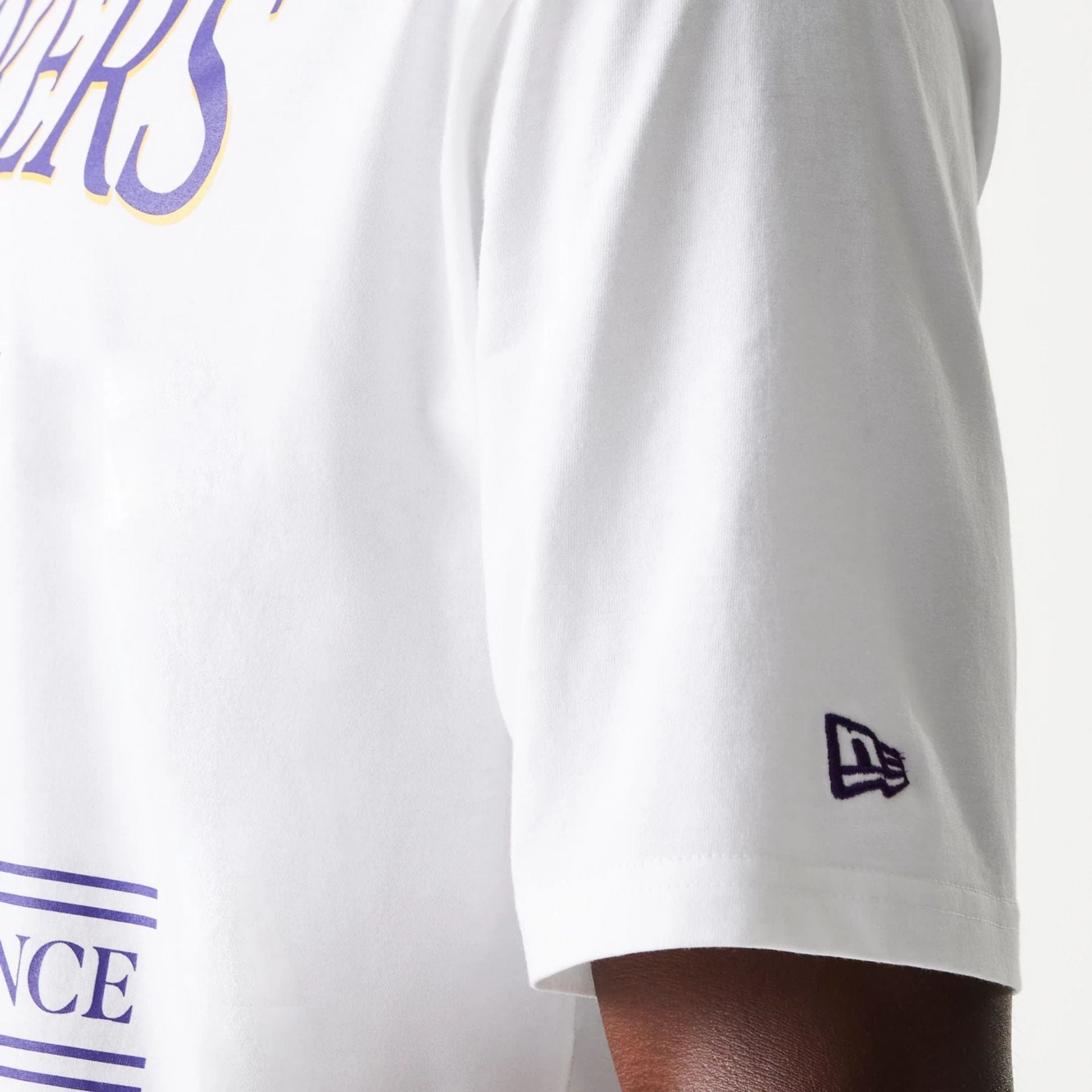 The Male model is wearing LA Lakers NBA Team Graphic White Oversized T-Shirt 6