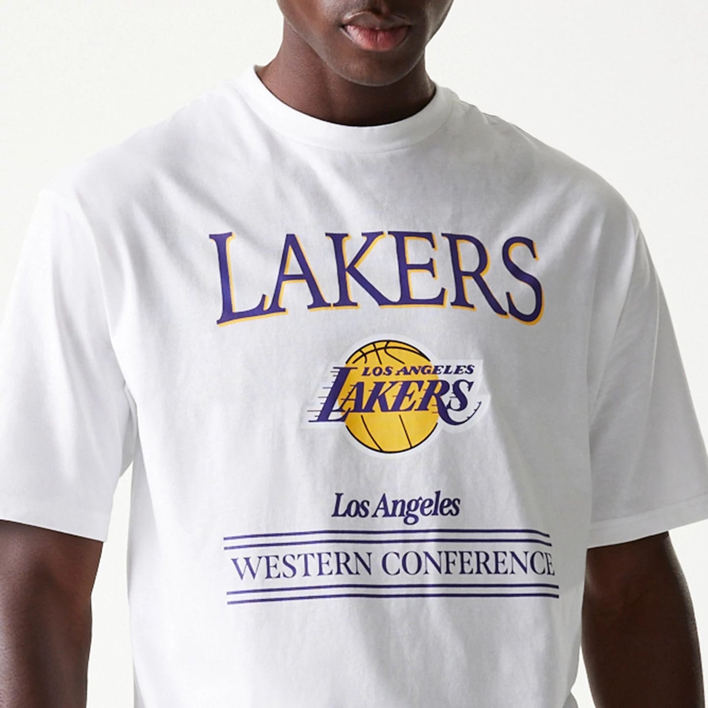 The Male model is wearing LA Lakers NBA Team Graphic White Oversized T-Shirt 4