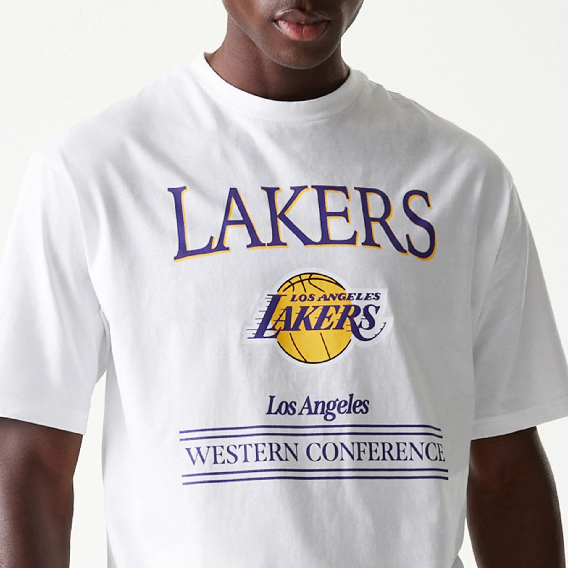 The Male model is wearing LA Lakers NBA Team Graphic White Oversized T-Shirt 4