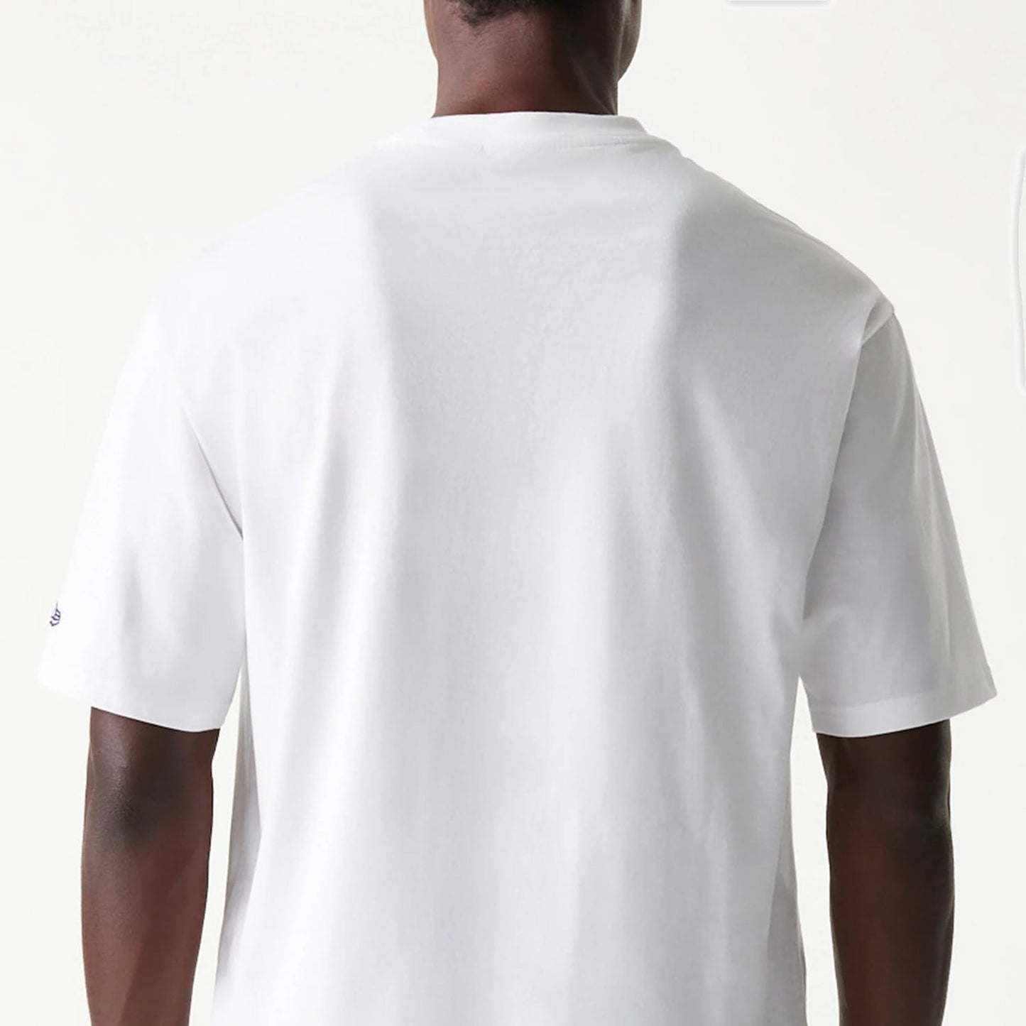 The Male model is wearing LA Lakers NBA Team Graphic White Oversized T-Shirt 7