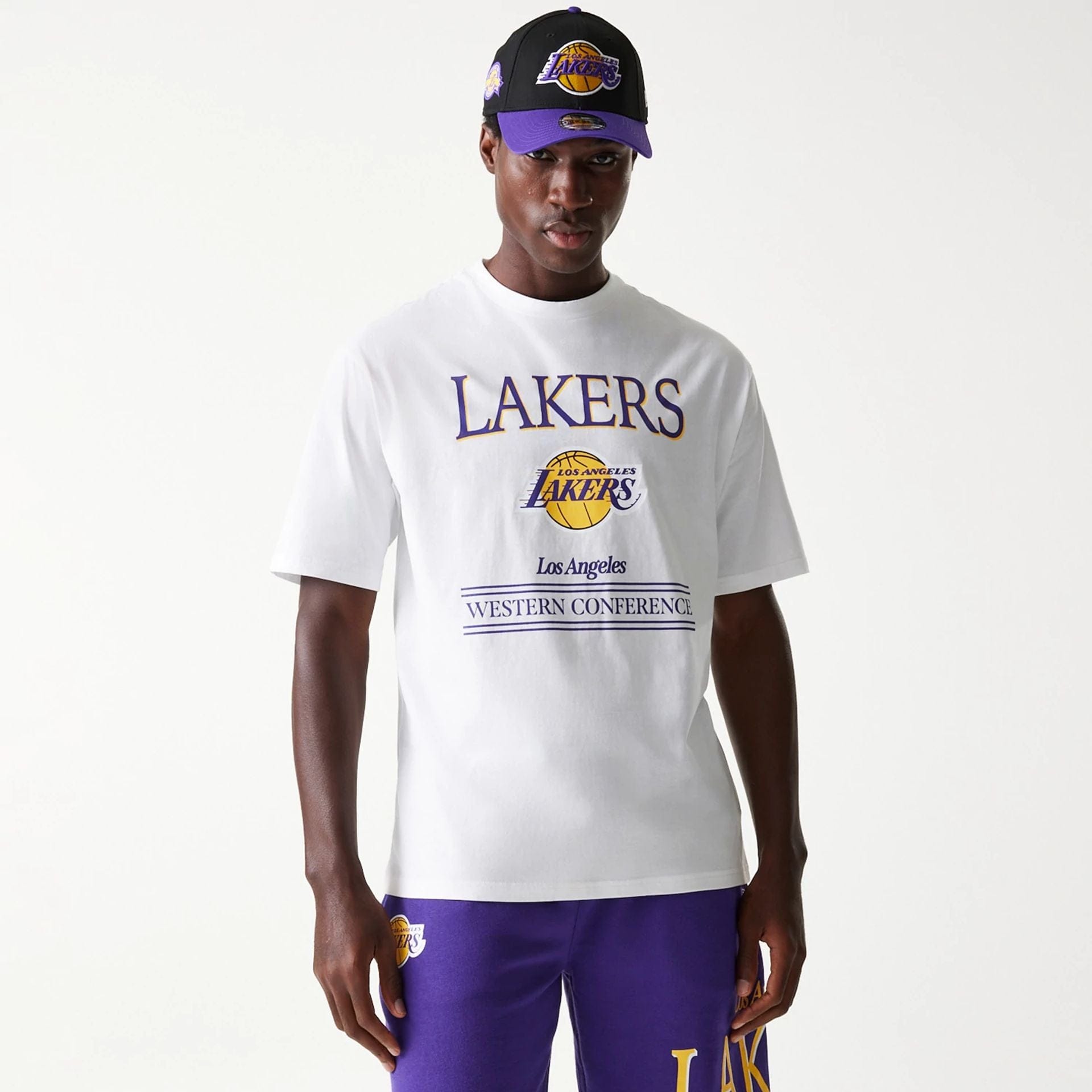 The Male model is wearing LA Lakers NBA Team Graphic White Oversized T-Shirt 3