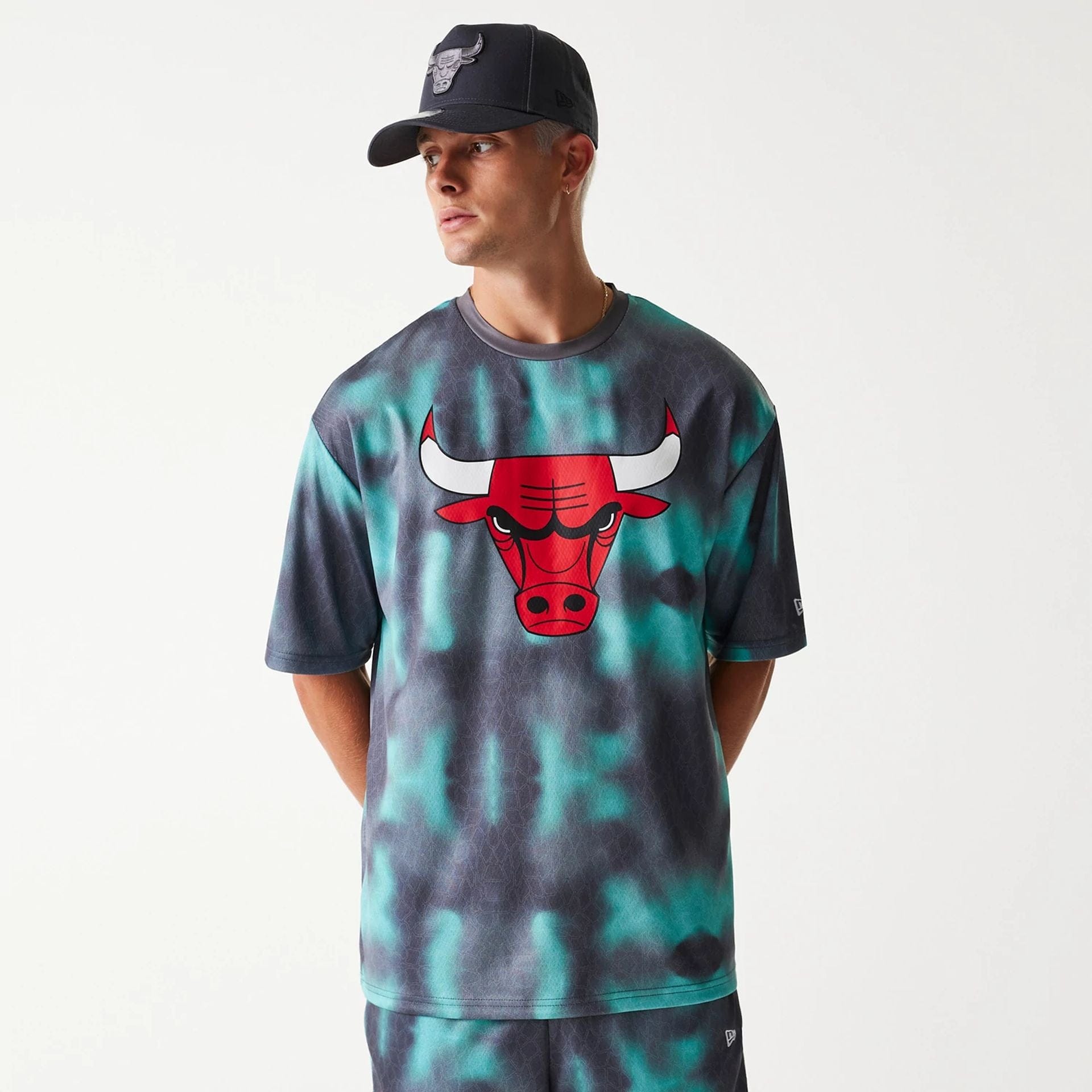 The Male model is wearing Chicago Bulls NBA All Over Print Green Oversized T-Shirt 1