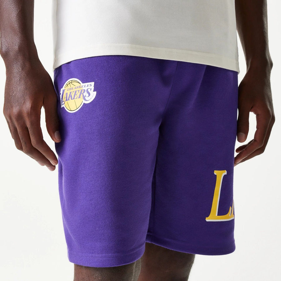 The Male model is wearing LA Lakers NBA Team Graphic Purple Shorts 6