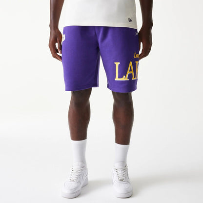 The Male model is wearing LA Lakers NBA Team Graphic Purple Shorts 1