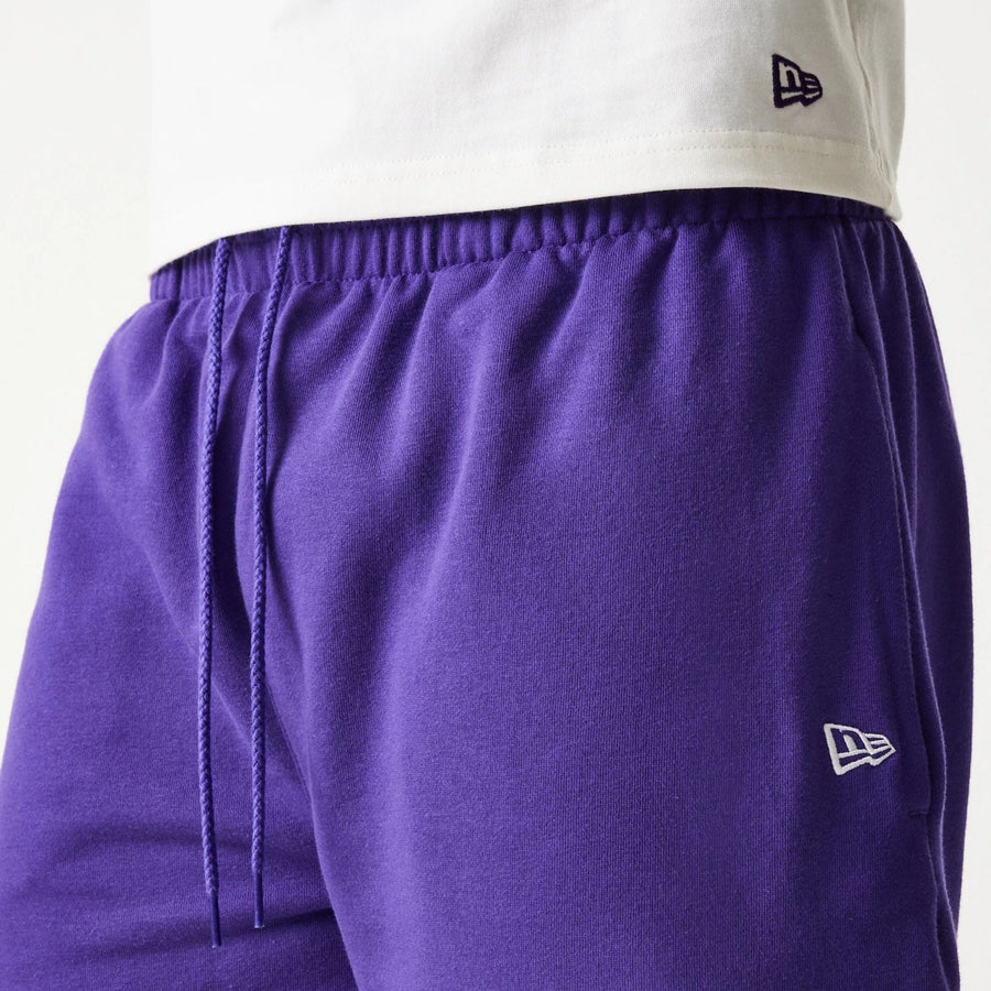 The Male model is wearing LA Lakers NBA Team Graphic Purple Shorts 7