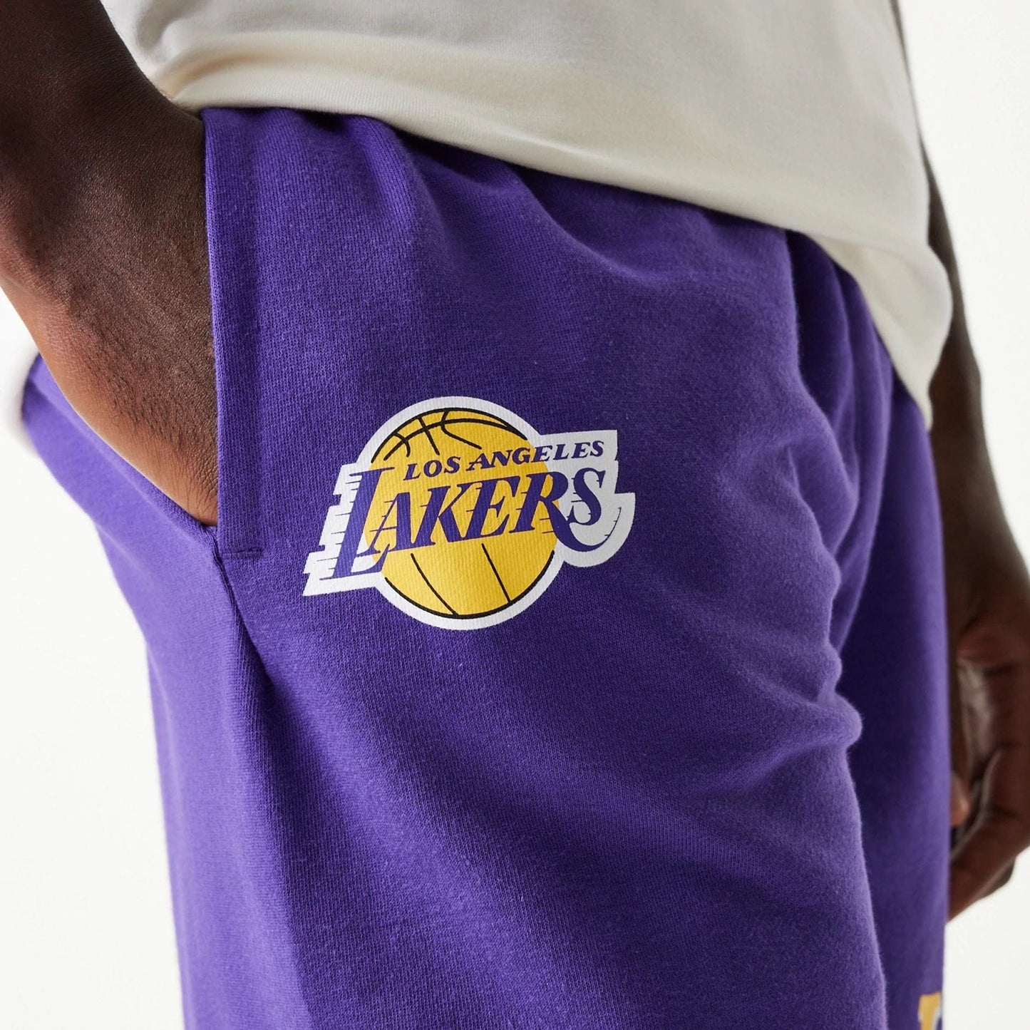 The Male model is wearing LA Lakers NBA Team Graphic Purple Shorts 4
