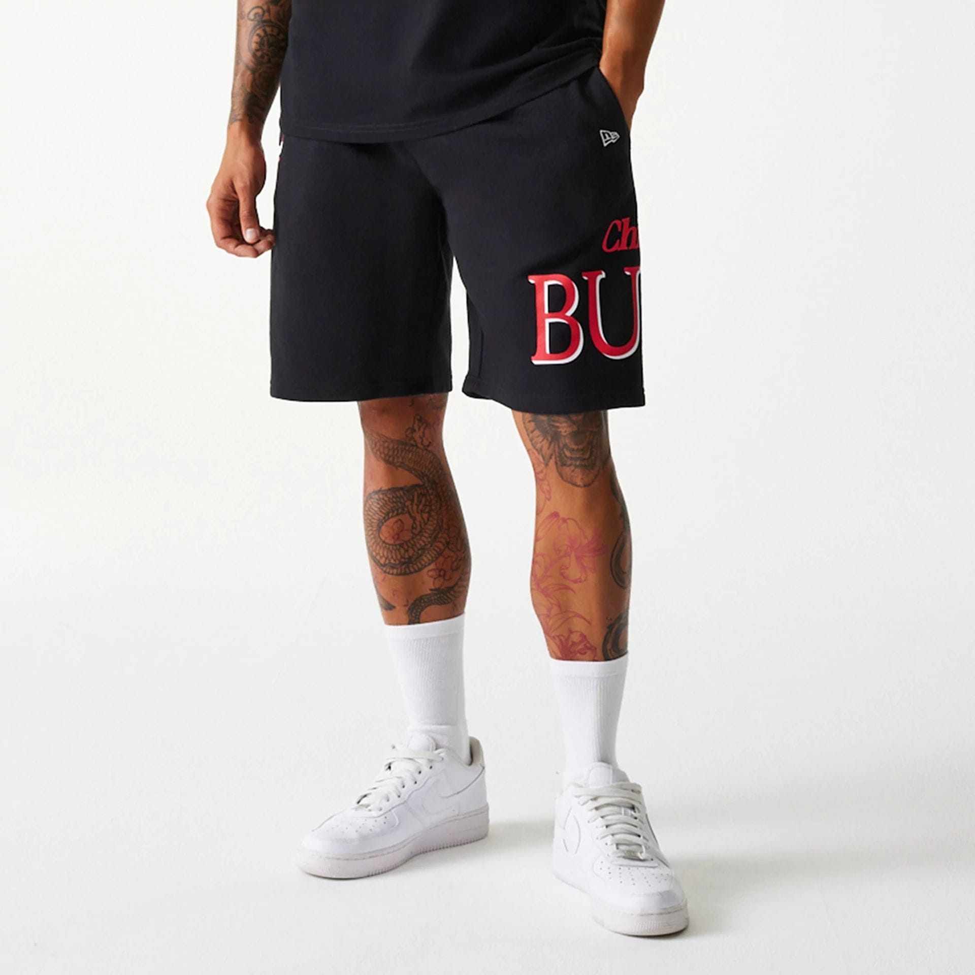 The Male model is wearing Chicago Bulls NBA Team Graphic Black Shorts 1