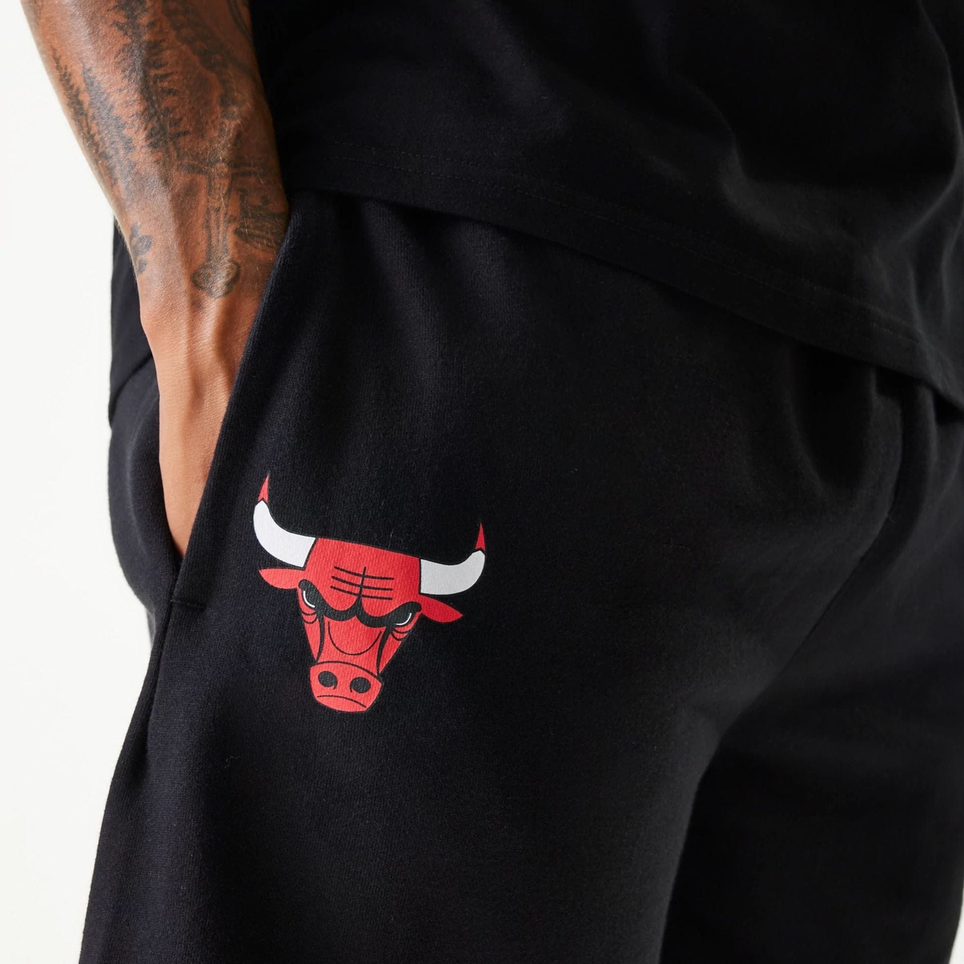 The Male model is wearing Chicago Bulls NBA Team Graphic Black Shorts 7