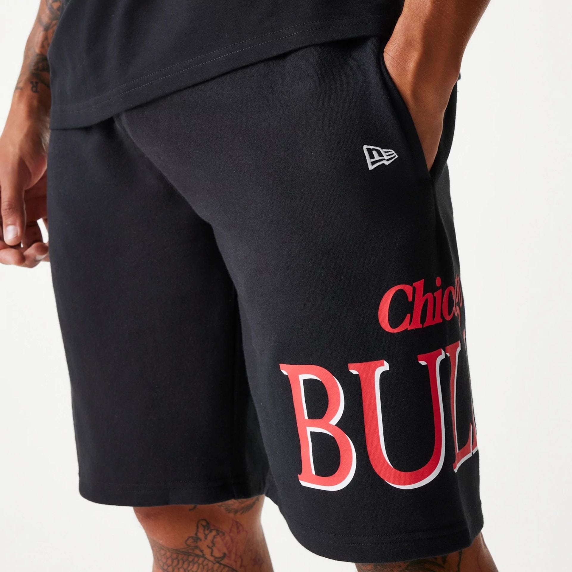 The Male model is wearing Chicago Bulls NBA Team Graphic Black Shorts 3