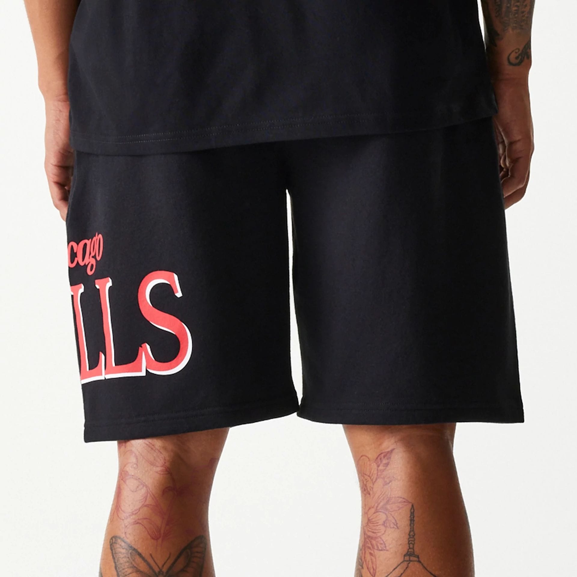 The Male model is wearing Chicago Bulls NBA Team Graphic Black Shorts 5