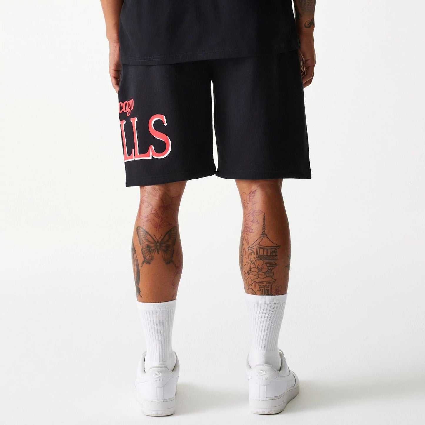 The Male model is wearing Chicago Bulls NBA Team Graphic Black Shorts 2
